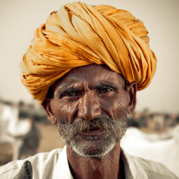 Portrait of an indian cattle merchant at the Pushkar Camel Fair, Pushkar, Rajasthan, India. Portrait Series.