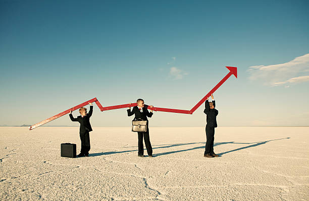 istock Business Boys Holding Line Graph in Desert 125142208