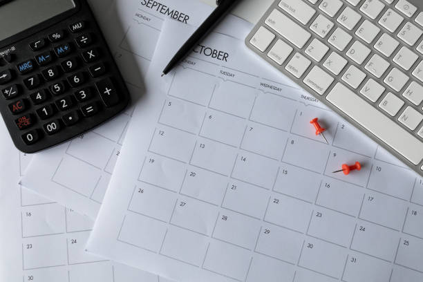 istock top view of office desk workspace with coffee cup, keyboard and work schedule on white table background. flat lay 1251422325