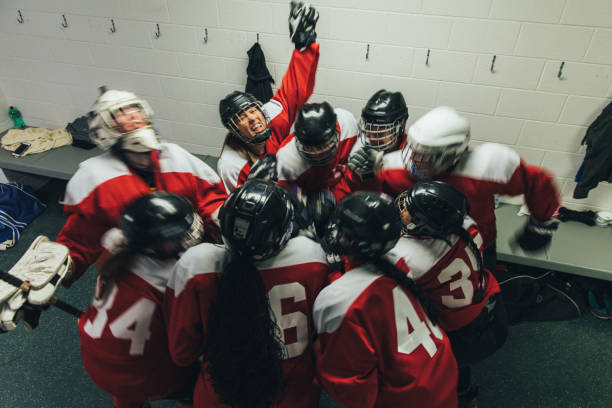 istock Women's Ice Hockey Team Celebrates 1251422944