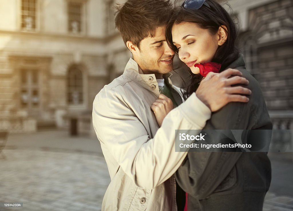 Young romantic couple embracing and smiling Young romantic couple embracing and smiling, beautiful girl closed her eyes and enjoy the moment. Adult Stock Photo