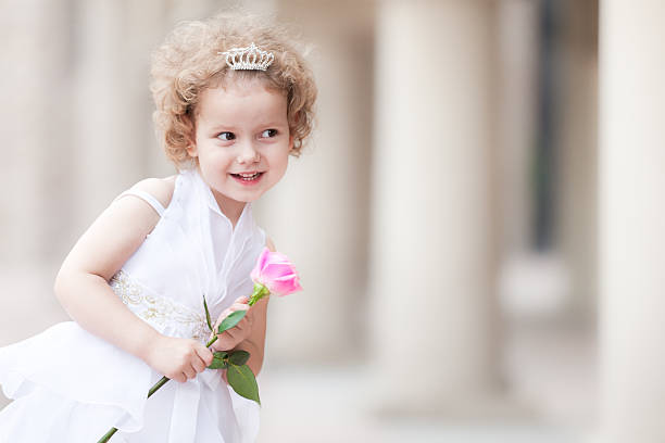 Little Princess Little girl in wedding dress fairy rose stock pictures, royalty-free photos & images