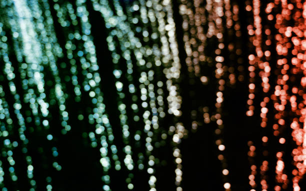 istock Blue and red blurred bokeh background at the dark. 1251424611
