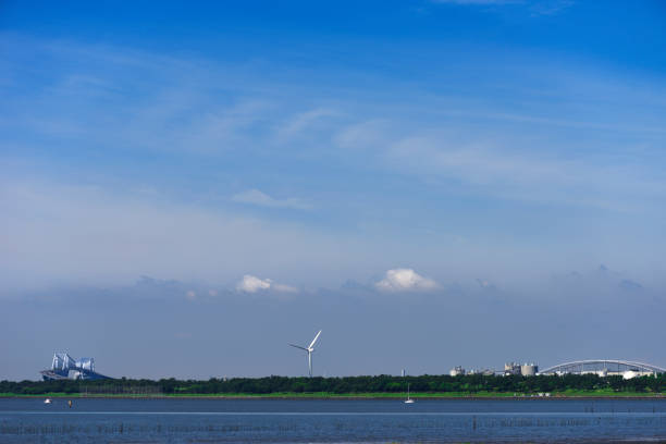 Tokyo Bay and Tokyo Gate Bridge against blue sky.