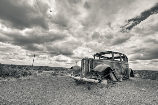 Car Wreck in USA. The photo was taken with the HDR technique which combines photos taken at different exposure and blended together. The photo was then converted to black and white and toned differently for highlight and shadows. A vignetting was added to balance the composition.