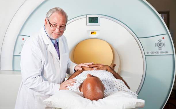 istock Doctor with patient getting MRI scan 125143039