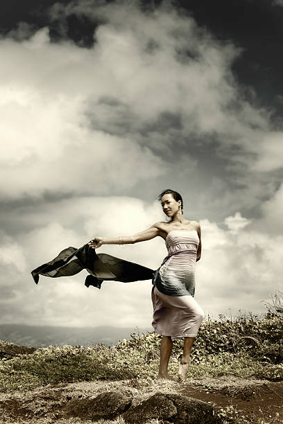 Woman on top of mountain