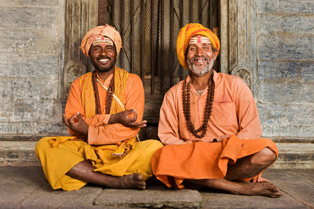 Smiling south indian family greeting in prayer pose