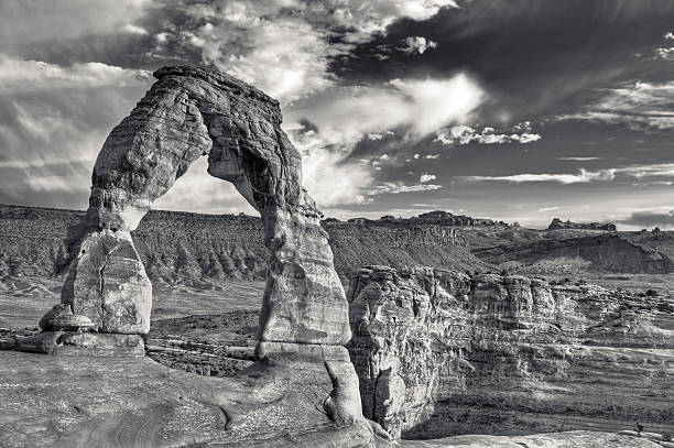 Delicate Arch, Arches National Park Delicate Arch, Arches National Park. The photo was taken with the HDR technique which combines photos taken at different exposure and blended together. It was then converted to black and white. natural landmark photos stock pictures, royalty-free photos & images