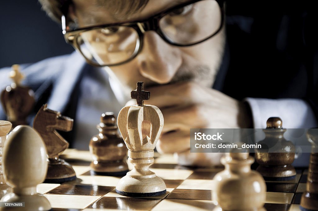 Consummate Focused Chess Player In Glasses Thinking On Next Move Stock  Photo - Download Image Now - iStock