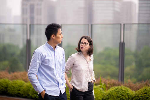 Multi-ethnic couple walking in city