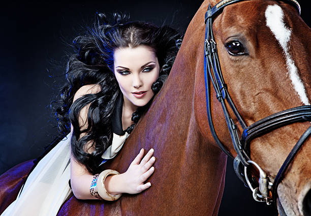 istock woman riding on horse 125143922