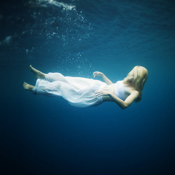 istock Young woman fall into deep water 125144133