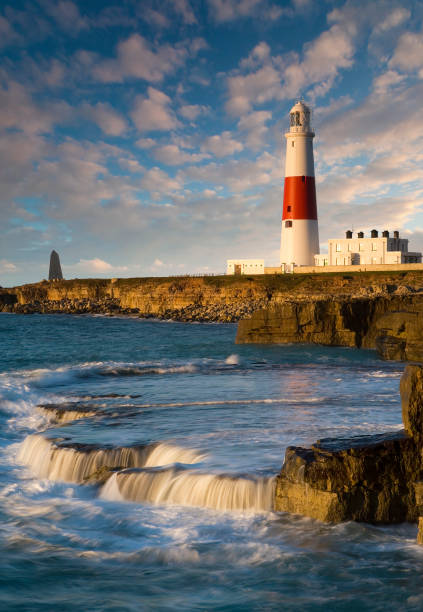 Dawn over Portland Bill lighthouse The beautiful lighthouse at Portland Bill on the jurassic world heritage coastline of Dorset, U.K bill of portland stock pictures, royalty-free photos & images