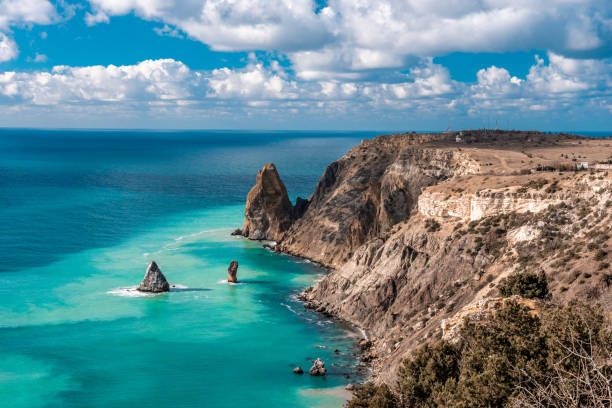 istock cape in the sea, azure water after storm, clouds 1251442096