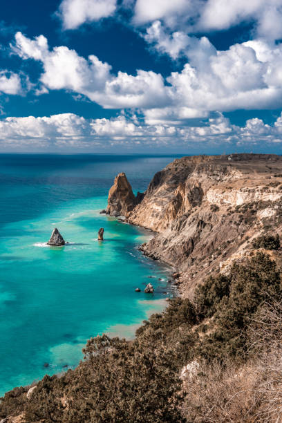 istock cape in the sea, azure water after storm, clouds 1251442165