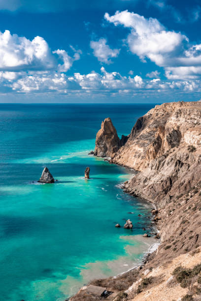 istock cape in the sea, azure water after storm, clouds 1251442185