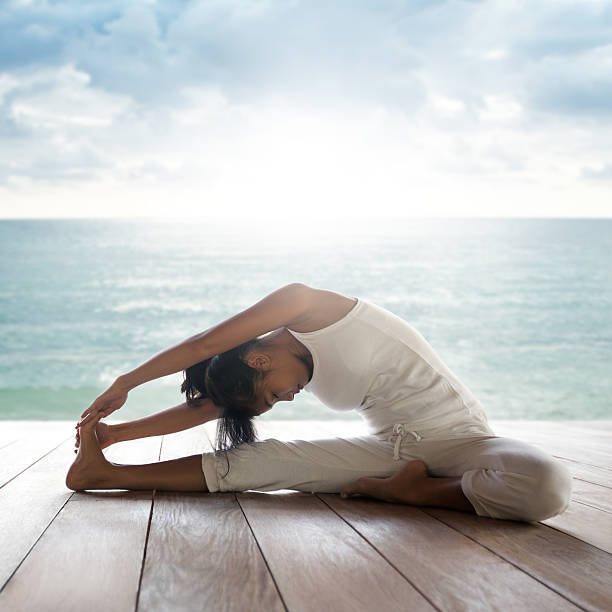 Yoga: Janusirsasana (Head to Knee Pose) stock photo