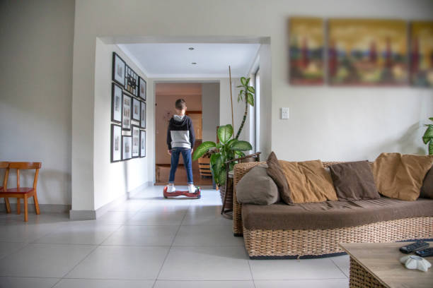 istock A Nine-year-old boy riding his motorized hoverboard at home. 1251443561