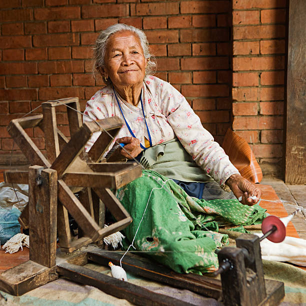 istock Nepali woman spinning the wool. Bhaktapur 125144398