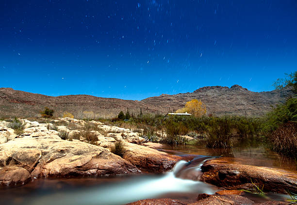 House by the river River flowing, with house in the background, Cederberg, South Africa, Long Exposure. cederberg mountains photos stock pictures, royalty-free photos & images