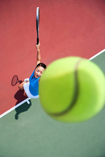 istock Tossing tennis ball and serve 125144482