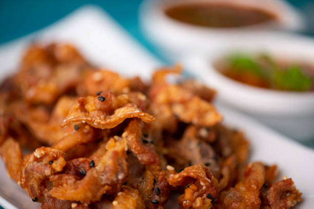 istock Crispy fried sliced belly pork with spicy sauce 1251445444