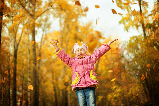 istock Child in autumn park 125144572