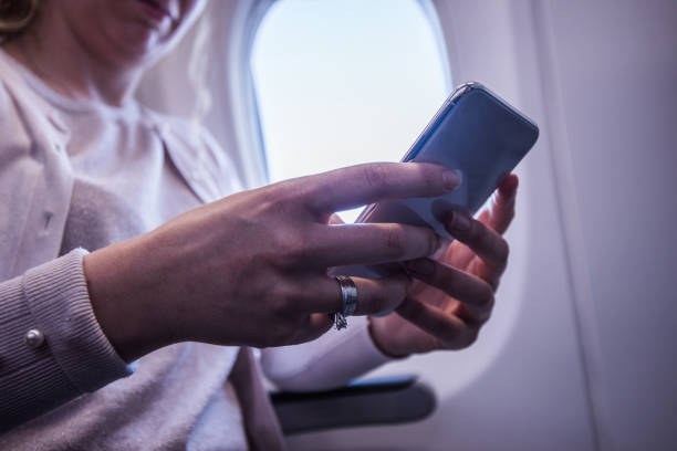 istock Curly woman holding mobile, close up. 1251446935