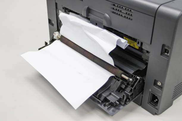 istock Paper A4 Stuck In Printer At Office, concept repair printer 1251447899