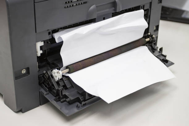 istock Paper A4 Stuck In Printer At Office, concept repair printer 1251447900