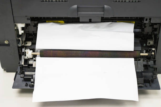 istock Paper A4 Stuck In Printer At Office, concept repair printer 1251447907