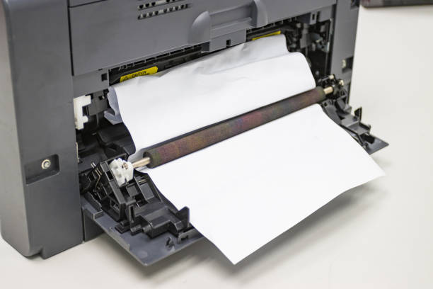 istock Paper A4 Stuck In Printer At Office, concept repair printer 1251447913