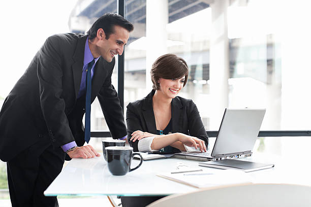 istock Business Coworkers Using Laptop During Meeting in Glass Office, Copyspace 125144975