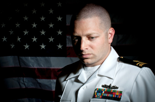 Portrait of a Caucasian Naval Officer in front of American Flag