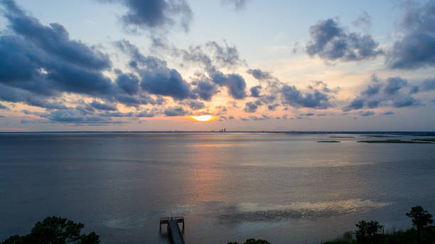 istock Overcast sunset on Mobile Bay, Alabama 1251451081