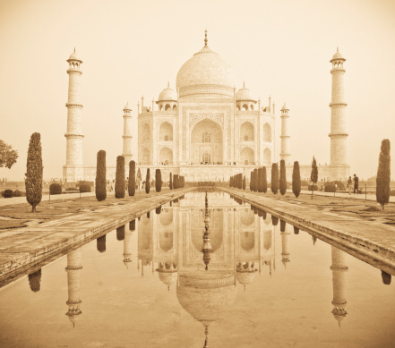 Straightaway image of Taj Mahal in beautiful early morning sunrise light, vintage style