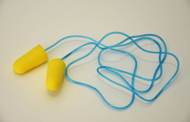 istock foam earplugs provide protection against harmful noise, green Protective earplugs 1251453411