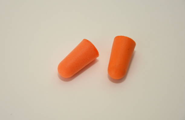 istock foam earplugs provide protection against harmful noise, orange  Protective earplugs 1251453433