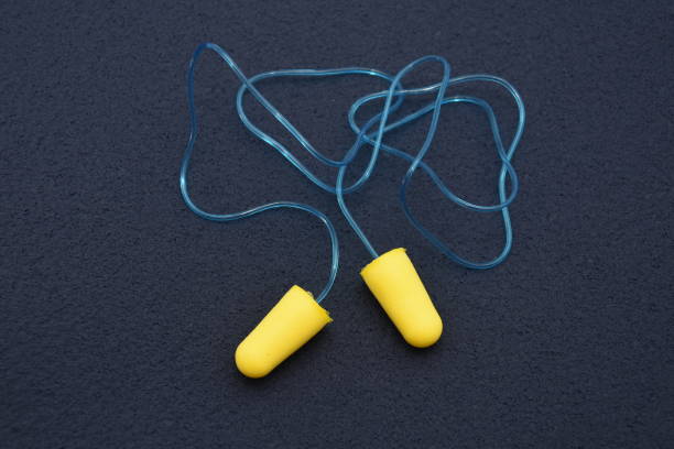istock foam earplugs provide protection against harmful noise, green Protective earplugs 1251453475