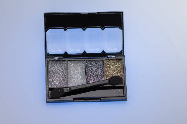 istock Make up set and brushes, Glossy make-up powder background. Makeup palette 1251453584