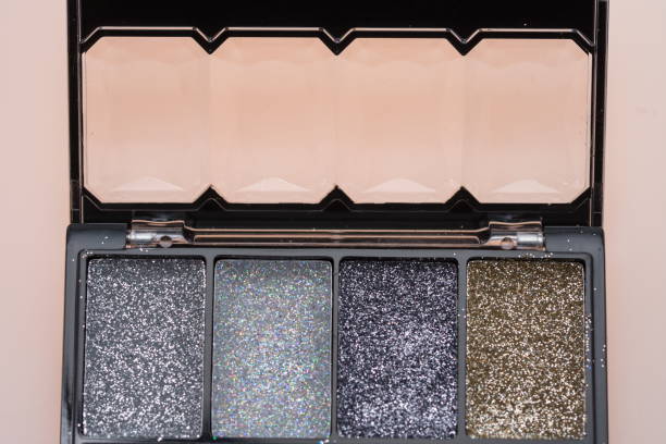 istock Make up set and brushes, Glossy make-up powder background. Makeup palette 1251453628