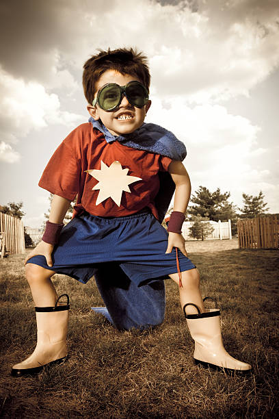 istock Young Boy Dressed Up In Superhero Costume Crime Fighter 125145429