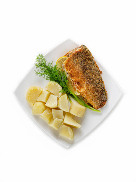 istock headless fish carcass fried breaded on a square plate with boiled potatoes and a sprig of fresh dill top view 1251457127