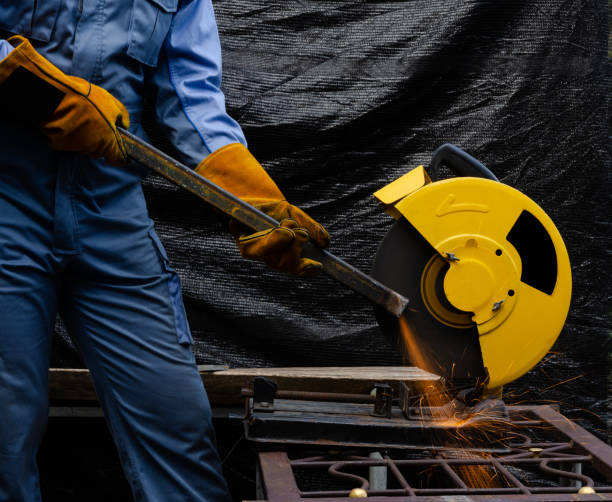 istock Worker grinding hollow structural steel with circular abrasive saw tool 1251457251