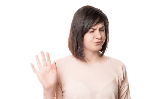 istock Woman Showing Stop Sign on white background isolate 1251458363