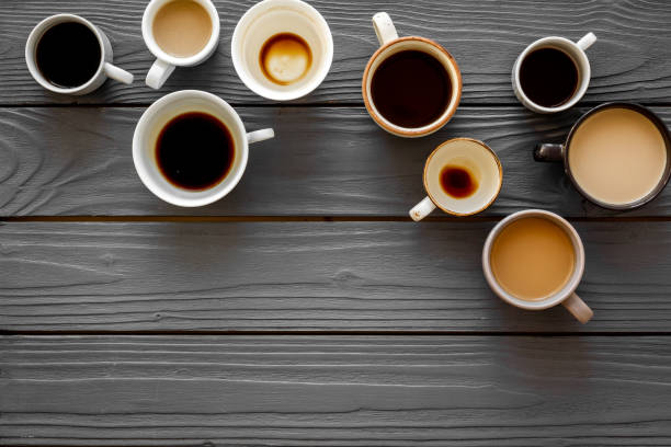 istock Many cups of coffee on wooden table top-down copy space 1251467537