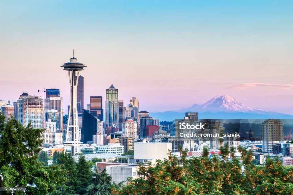 Seattle Cityscape with Mt. Rainier in the Background at Sunset, Washington, USA Seattle Stock Photo