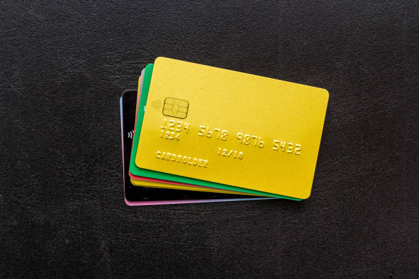 istock security concept. stack of credit card on black desk top-down 1251469768