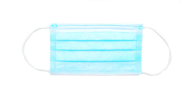 istock Blue medical mask isolated on white background 1251471478